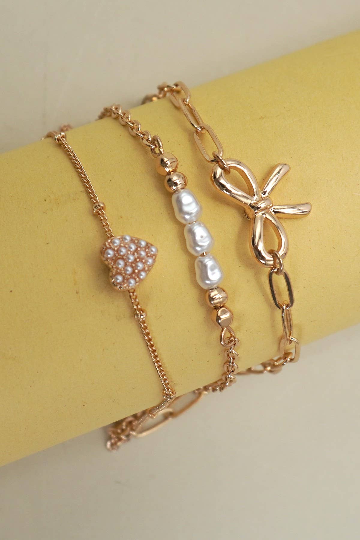 CHARM BRACELET-MULTI LAYER BOW PERAL HEART CHARMS