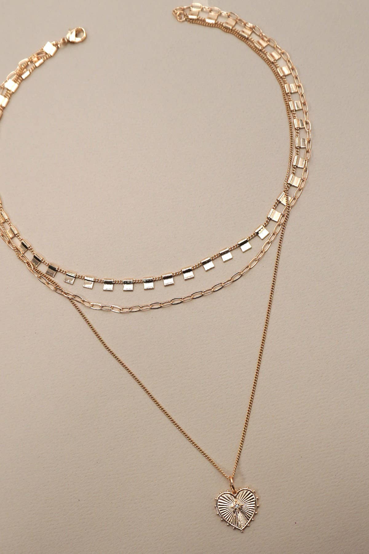MULTI LAYERED ETCHED HEART CHARM NECKLACE
