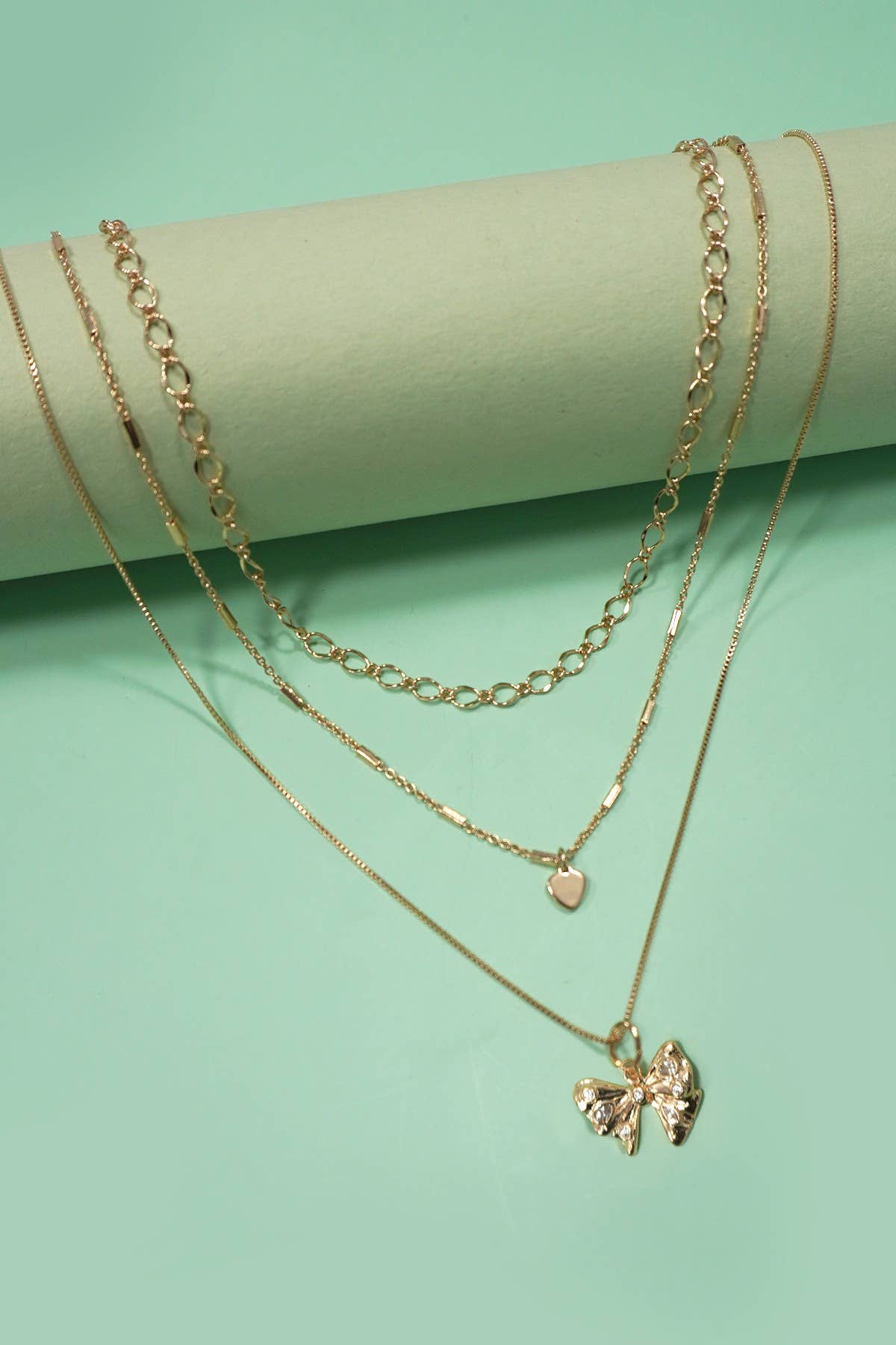 MULTI LAYERED BOW HEART NECKLACE