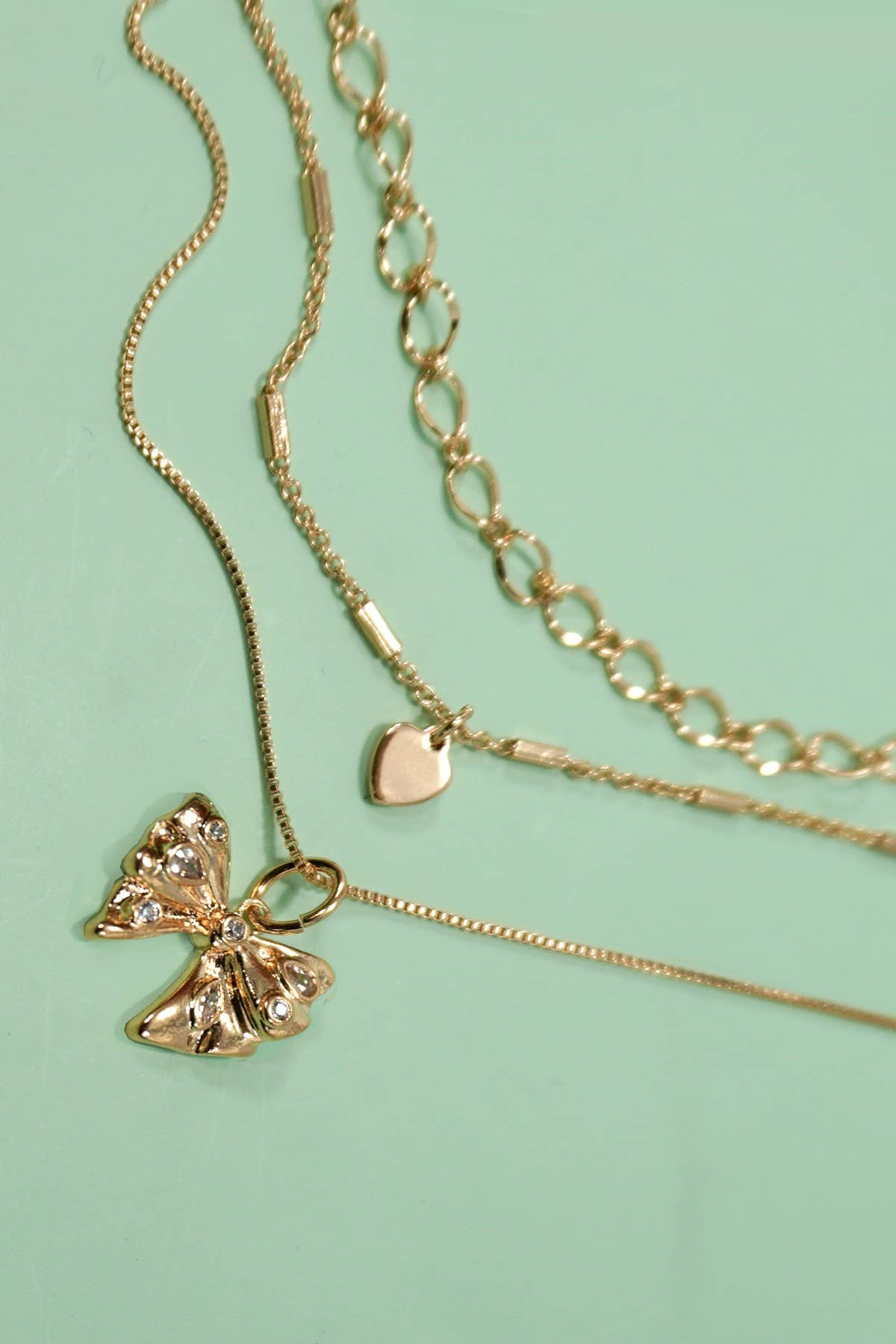 MULTI LAYERED BOW HEART NECKLACE