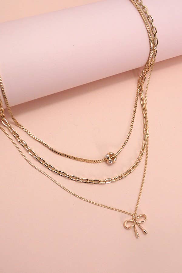 GOLD MULTI LAYER PEARL BOW CAHRM NECKLACE