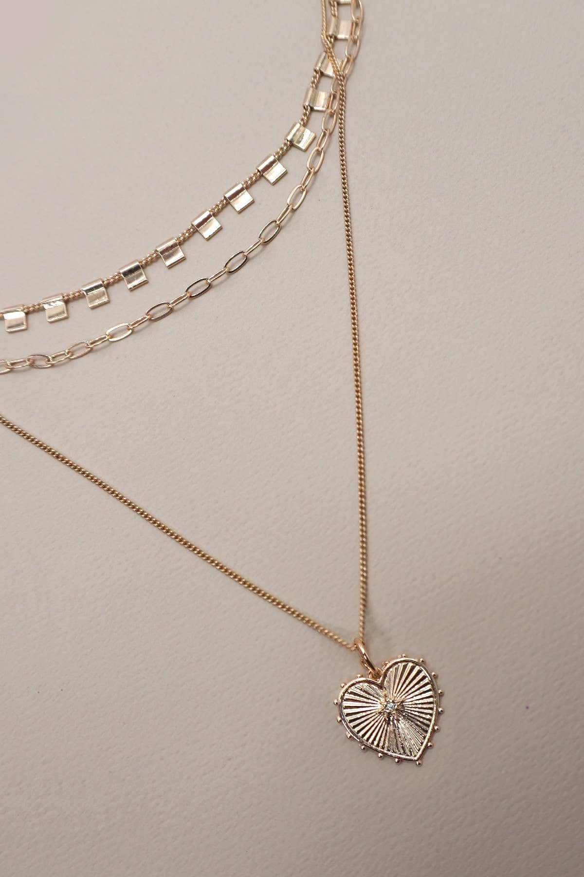 MULTI LAYERED ETCHED HEART CHARM NECKLACE